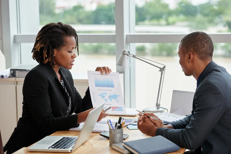 Professional consultants reviewing analytical charts